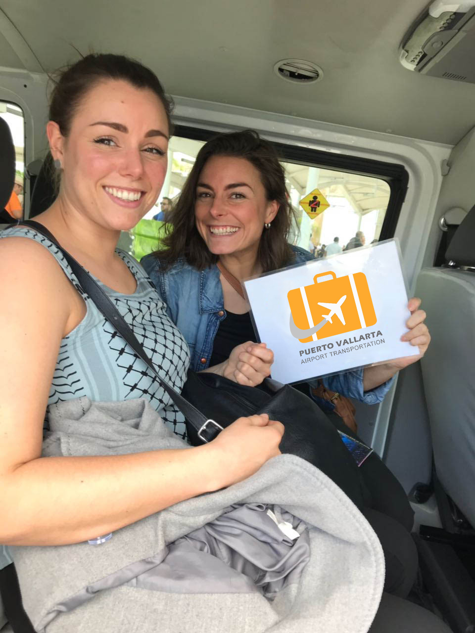 Two female friends being transported to their accommodation